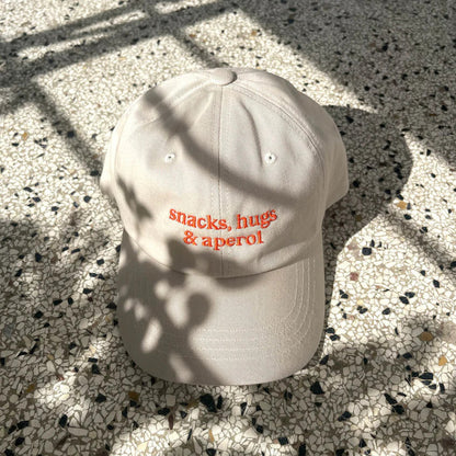 snacks, hugs & aperol Cap